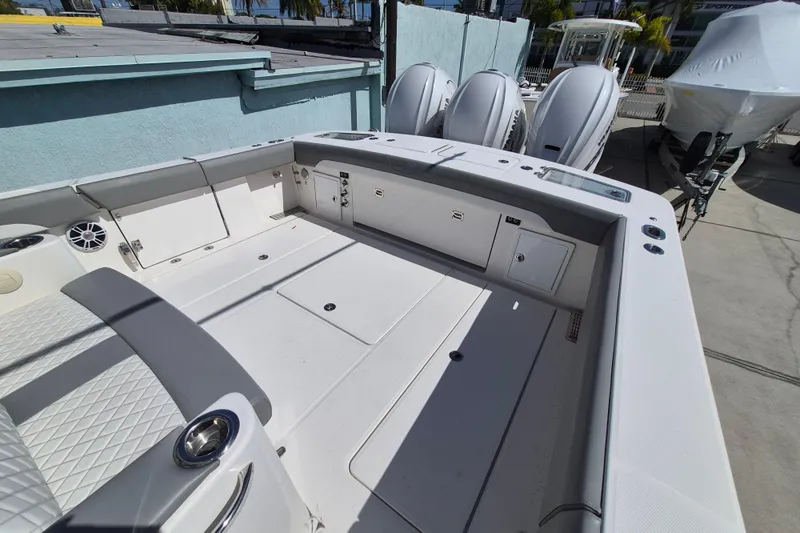 Slide: The Image of 2024 Regulator 37 boat deck with seating and storage compartments. - 25