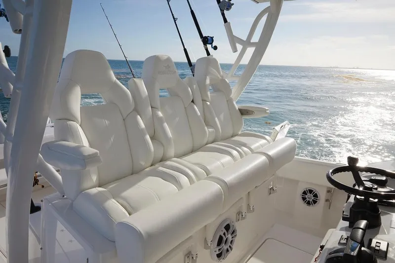 Slide: The Image of 2024 Regulator 37 boat with Yamaha engines on a trailer, under a clear blue sky. - 6