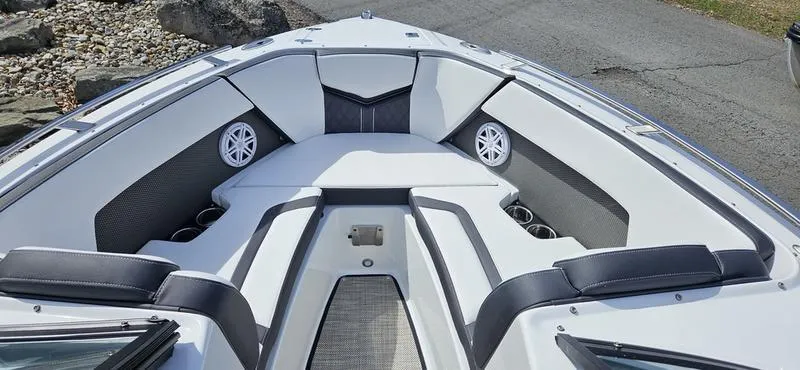 Slide: The Image of 2024 Monterey 238 Super Sport boat interior with white and black seating. - 4
