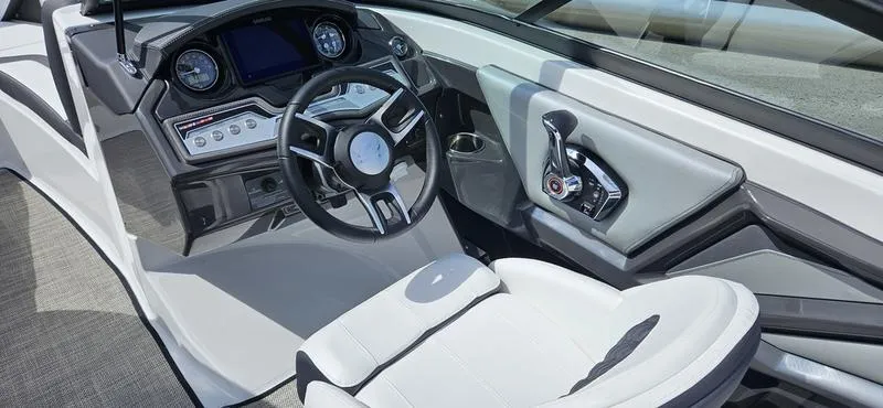 Slide: The Image of 2024 Monterey 238 Super Sport boat interior with modern dashboard and steering wheel. - 6