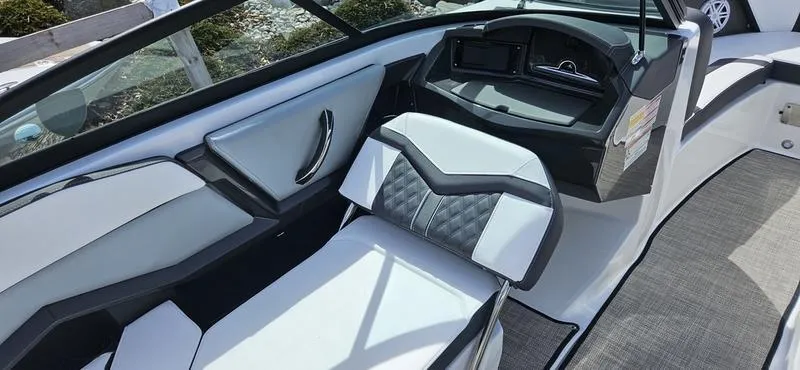 Slide: The Image of 2024 Monterey 238 Super Sport boat interior with modern seating and dashboard. - 8
