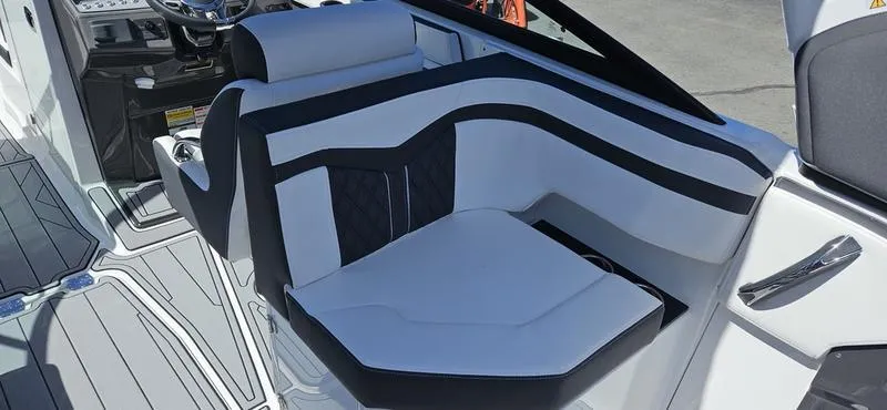 Slide: The Image of 2024 Monterey 258 boat interior with white and black seating. - 11