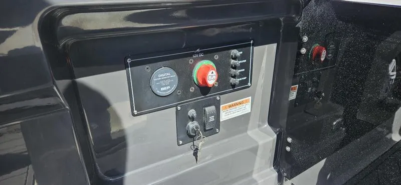 Slide: The Image of Control panel of a 2024 Monterey 258 boat with switches and key ignition. - 4