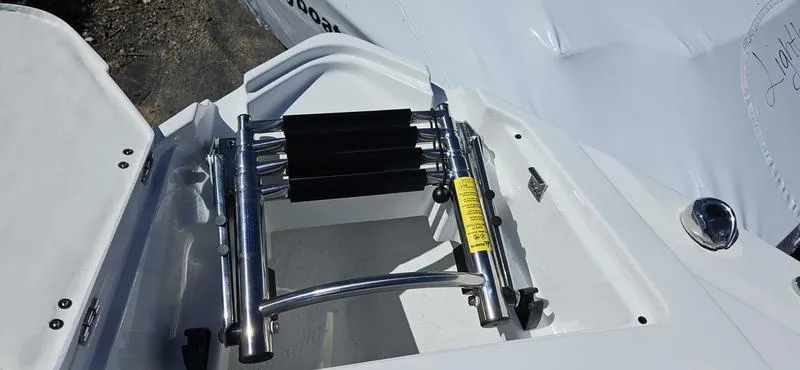 Slide: The Image of 2024 Monterey 258 boat with a folded stainless steel swim ladder. - 6