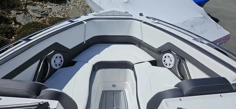 Slide: The Image of 2024 Monterey 258 boat interior with cushioned seating and built-in speakers. - 8