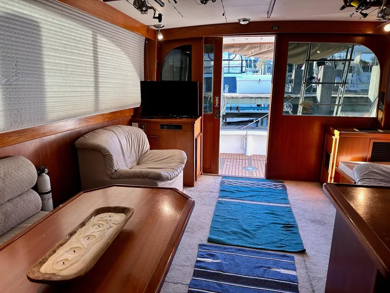Slide: The Image of Interior of 1987 Post 46 SPORT yacht with cozy seating and wooden accents. - 10