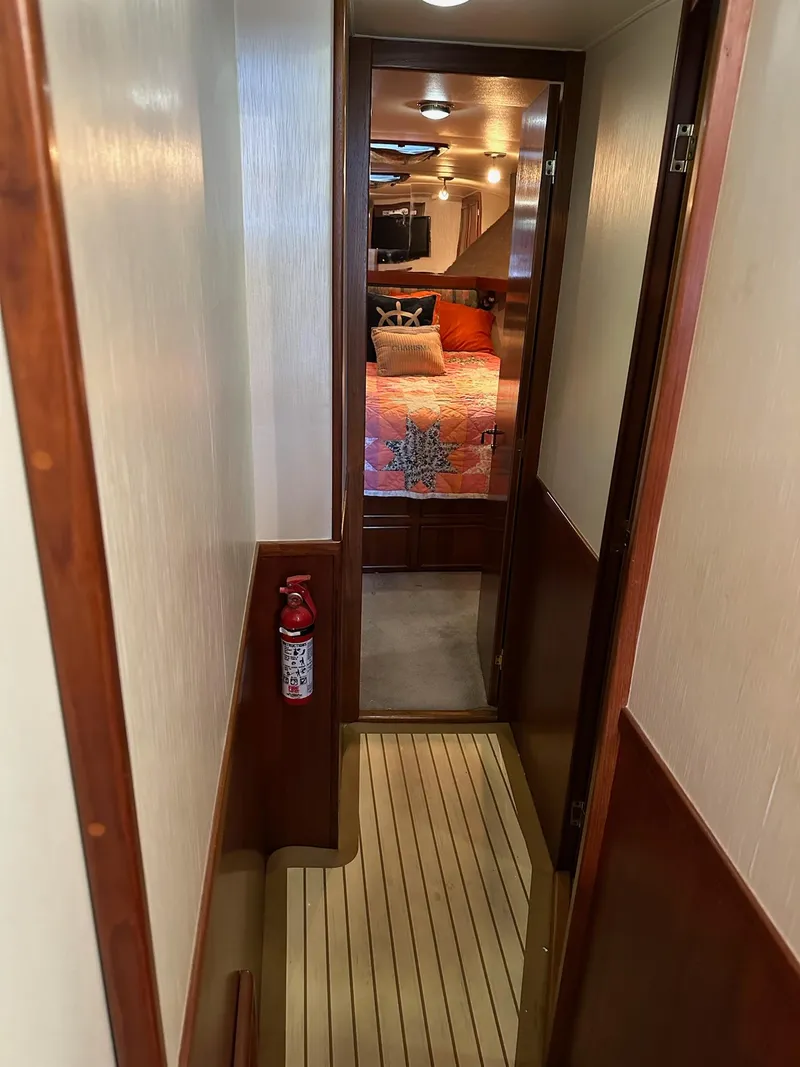 Slide: The Image of Narrow hallway on 1987 Post 46 SPORT yacht leading to a cozy bedroom. - 20