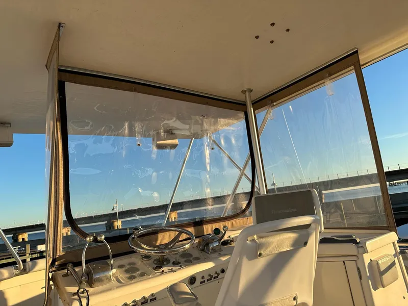Slide: The Image of Interior view of 1987 Post 46 SPORT boat helm with clear windows and steering wheel. - 7