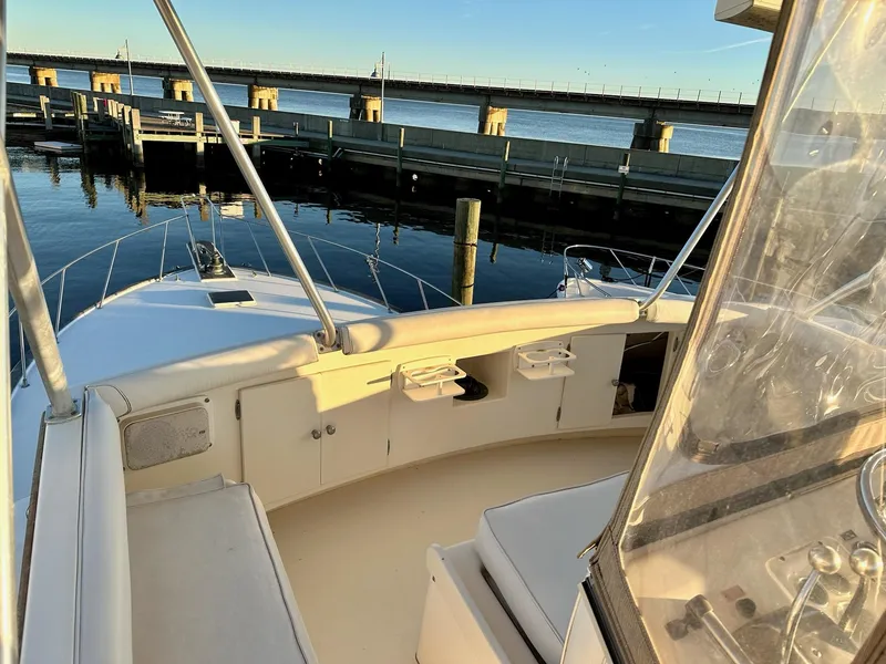 Slide: The Image of 1987 Post 46 SPORT yacht interior with marina view and bridge in background. - 8