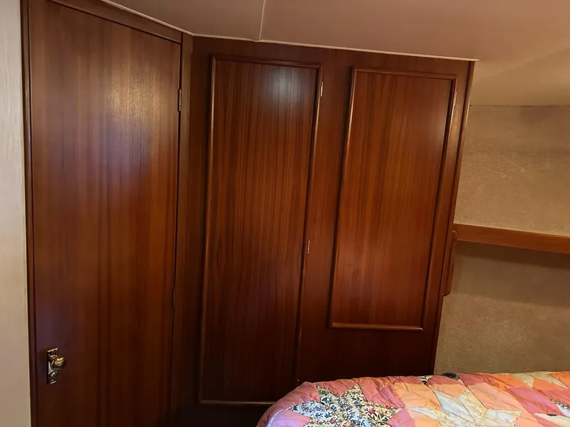 Slide: The Image of Wooden interior of 1987 Post 46 SPORT boat with quilted bedspread. - 22