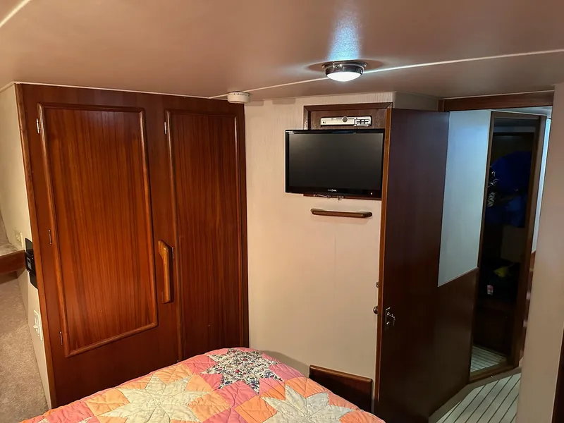 Slide: The Image of Cozy cabin interior of 1987 Post 46 SPORT yacht with TV and wooden cabinetry. - 23