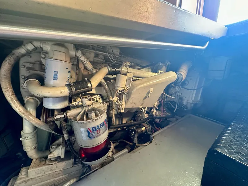 Slide: The Image of Engine compartment of a 1987 Post 46 SPORT boat, showcasing mechanical components. - 34
