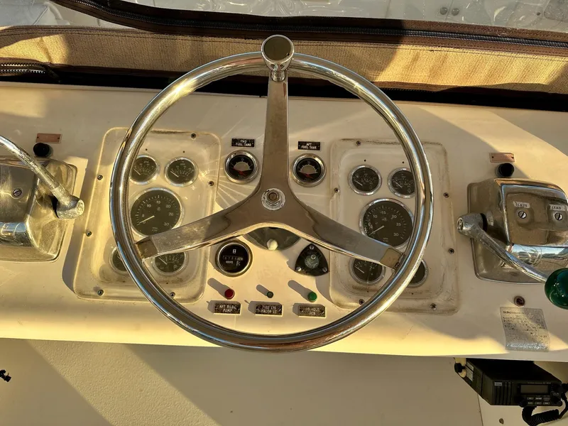 Slide: The Image of 1987 Post 46 SPORT boat helm with steering wheel and control panel. - 4