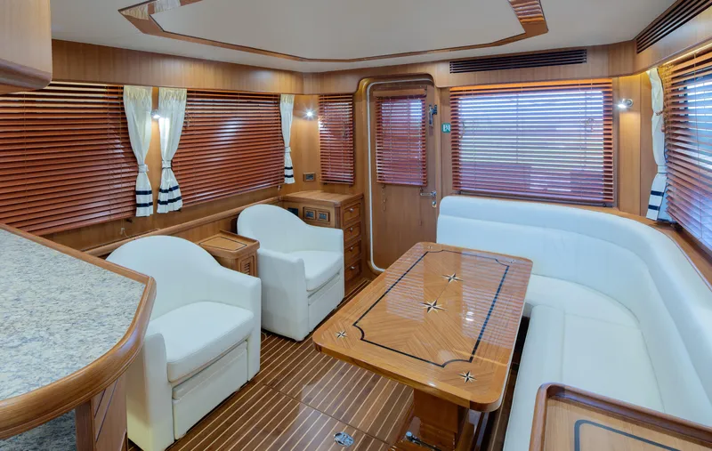 Slide: The Image of Luxurious interior of 2026 Selene 49 Classic Explorer yacht with elegant wood finishes and seating. - 11