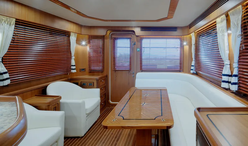Slide: The Image of Luxurious interior of 2026 Selene 49 Classic Explorer yacht with elegant wood and white furnishings. - 13