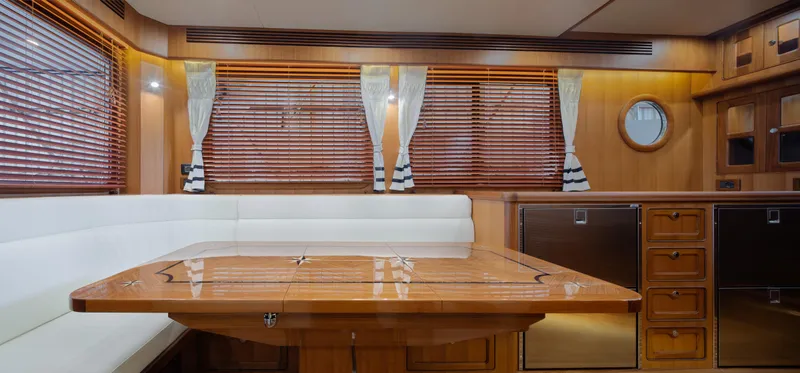Slide: The Image of Interior of 2026 Selene 49 Classic Explorer yacht with elegant wood finishes and white seating. - 14