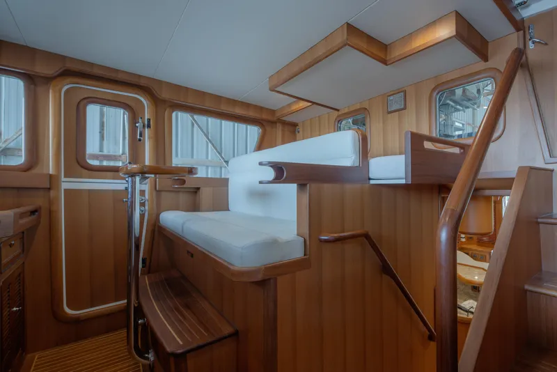 Slide: The Image of Interior of 2026 Selene 49 Classic Explorer yacht with wooden finishes and seating. - 18