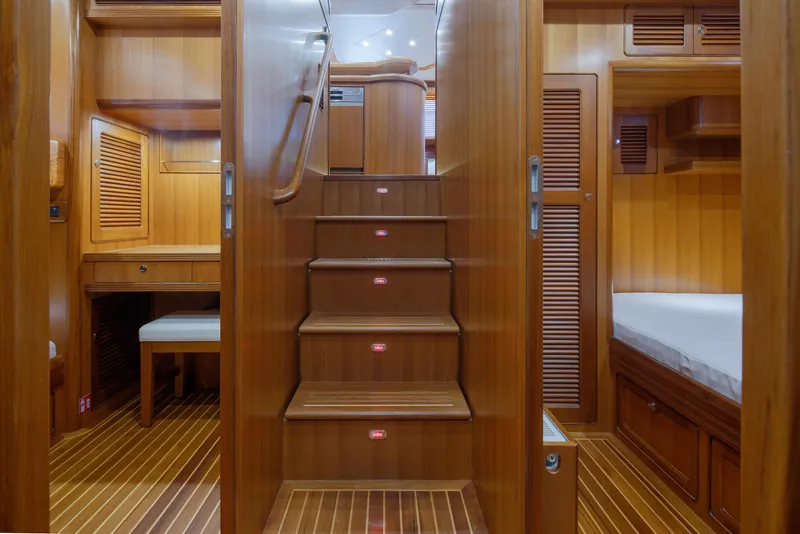 Slide: The Image of Interior of 2026 Selene 49 Classic Explorer yacht with wooden stairs and cabin. - 22