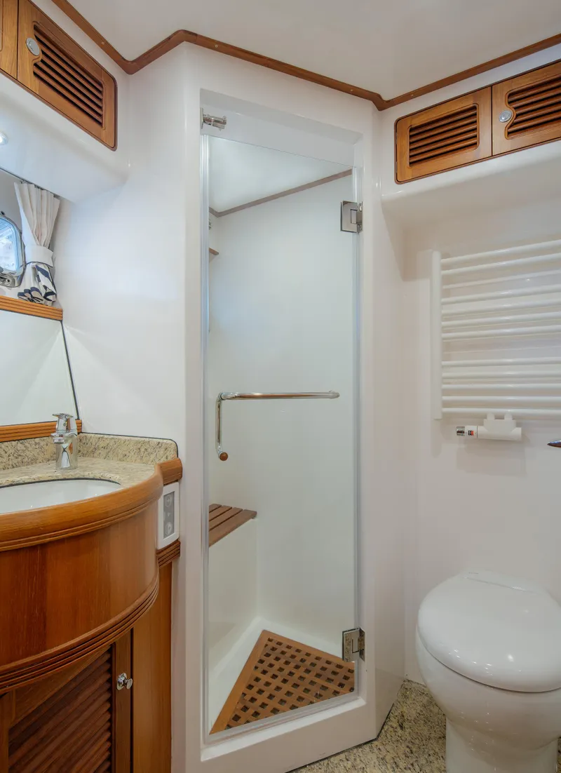 Slide: The Image of Luxurious bathroom in 2026 Selene 49 Classic Explorer yacht with shower and wooden accents. - 23