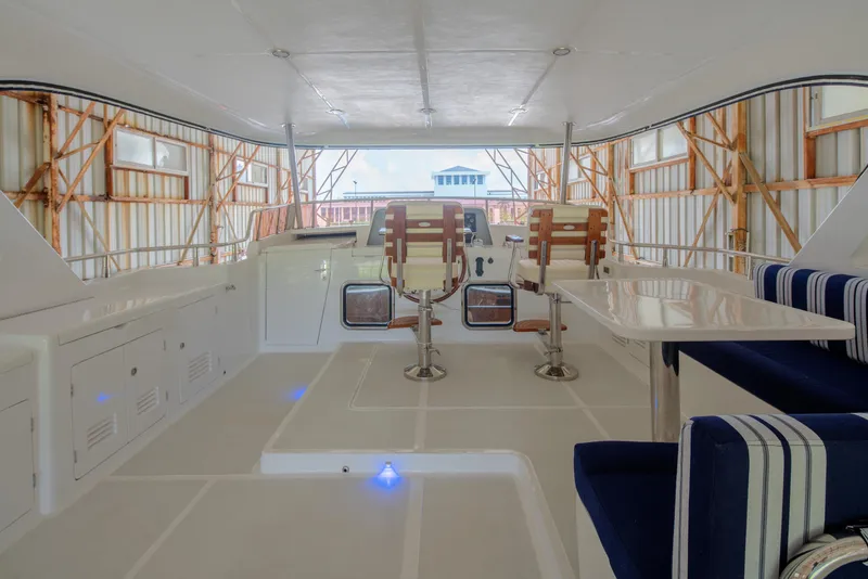 Slide: The Image of Interior of 2026 Selene 49 Classic Explorer yacht with seating and control area. - 25