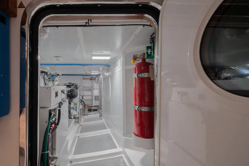Slide: The Image of Engine room of 2026 Selene 49 Classic Explorer yacht, featuring equipment and fire extinguisher. - 29