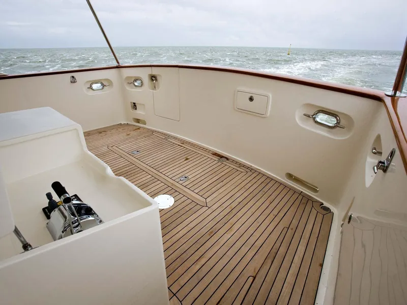 Slide: The Image of Deck of 2026 Selene 49 Classic Explorer yacht with wooden flooring and ocean view. - 8