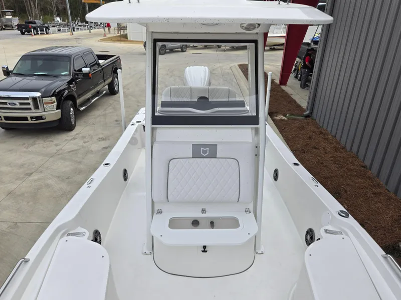 Slide: The Image of 2024 Sea Fox 251 Bay Fox boat interior with center console and seating. - 13