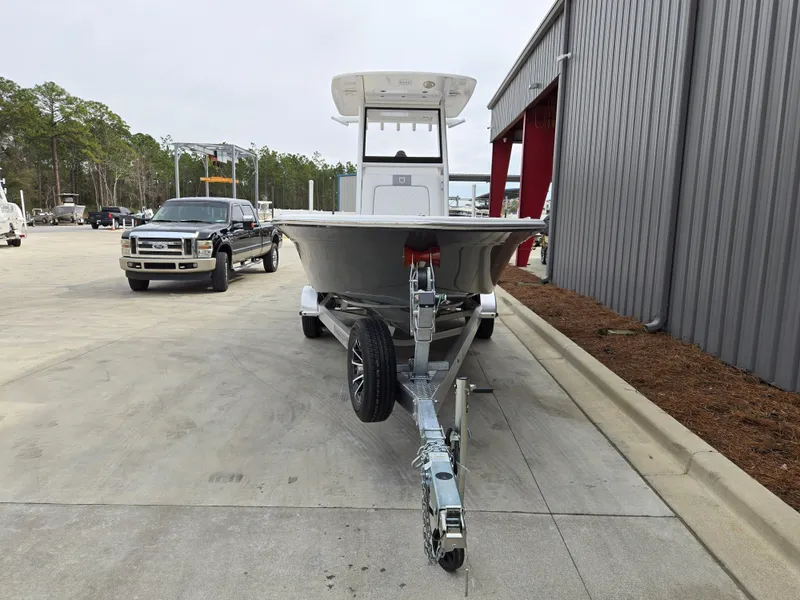 Slide: The Image of 2024 Sea Fox 251 Bay Fox boat on a trailer in a parking lot. - 4