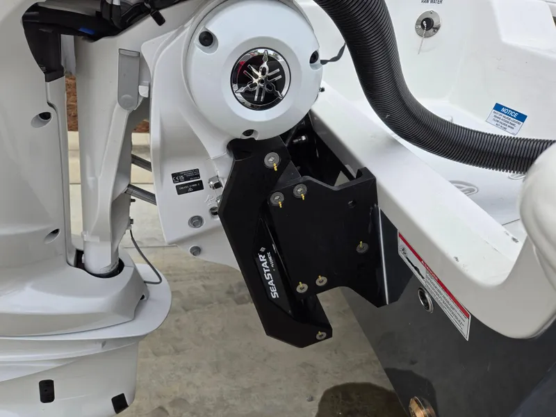 Slide: The Image of Close-up of 2024 Sea Fox 251 Bay Fox boat engine and SeaStar hydraulic steering. - 6