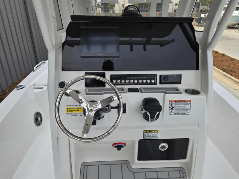 Slide: The Image of 2024 Sea Fox 251 Bay Fox boat console with steering wheel and control panel. - 8