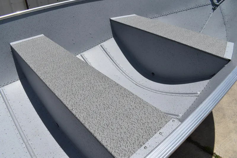 Slide: The Image of Interior view of 2024 Lowe WV 1470 boat, featuring textured seating and aluminum construction. - 5