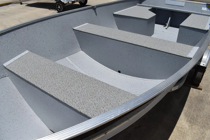 Slide: The Image of 2024 Lowe WV 1470 boat interior with gray seating and aluminum finish. - 7