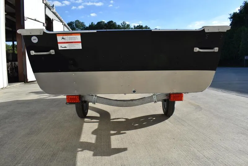 Slide: The Image of 2024 Lowe WV 1670 boat trailer rear view in outdoor setting. - 5