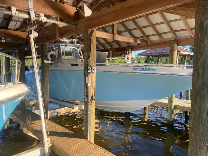 The Image of 2007 Fountain 38 CC Tournament Edition boat docked in a covered marina. - 0