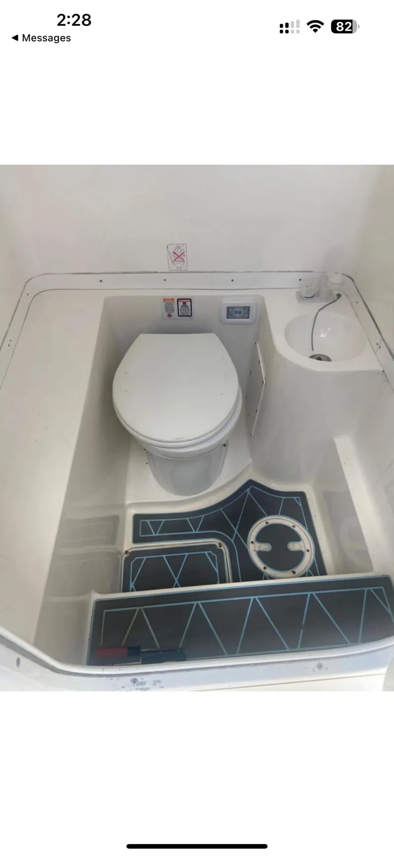 Slide: The Image of 2007 Fountain 38 CC Tournament Edition boat bathroom with toilet and sink. - 13