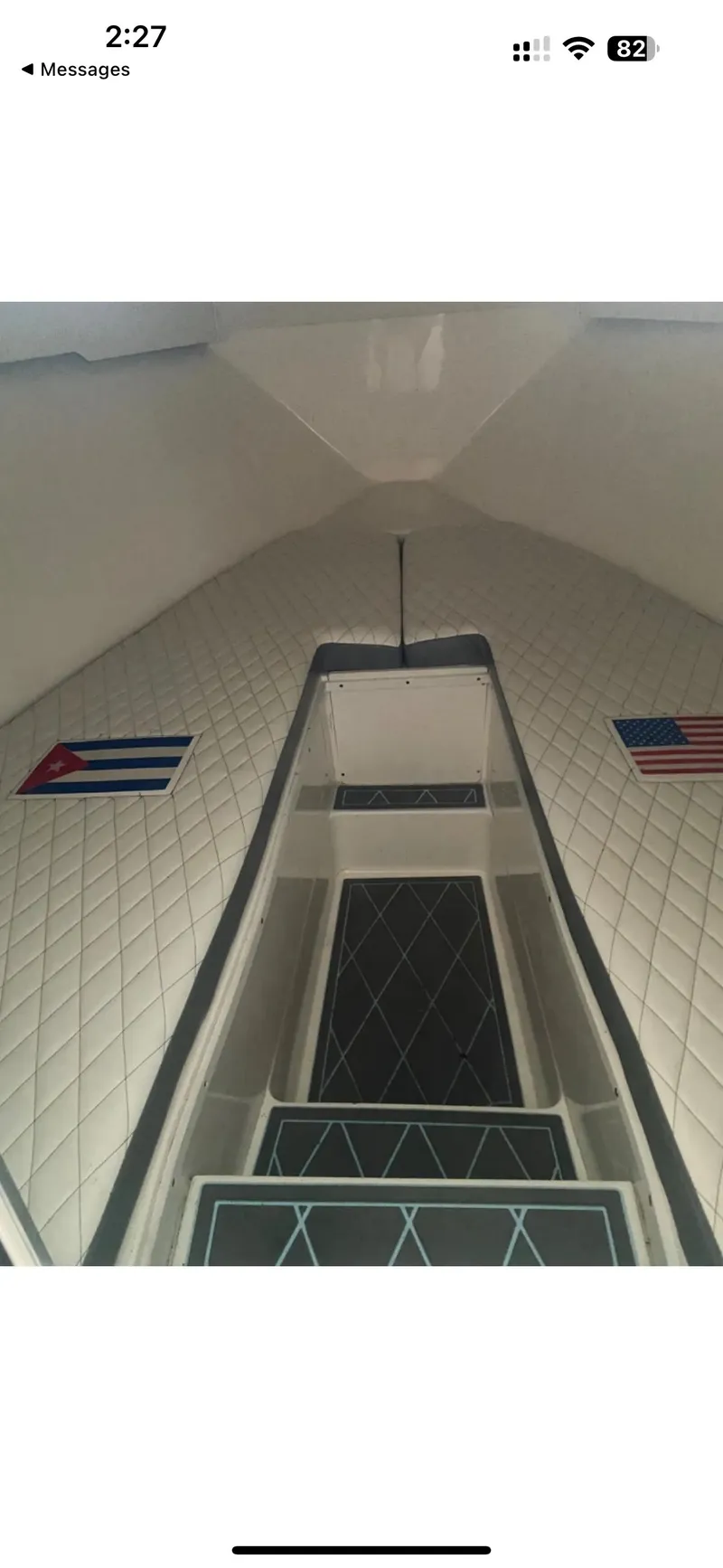 Slide: The Image of Interior of a 2007 Fountain 38 CC Tournament Edition boat with Cuban and American flags. - 5