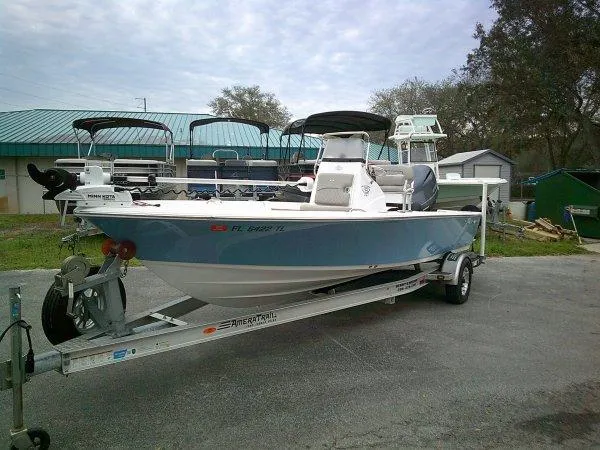 Slide: The Image of 2023 Sportsman Masters 207 boat on trailer in outdoor storage area. - 6