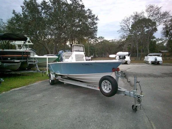 Slide: The Image of 2023 Sportsman Masters 207 boat on trailer in outdoor storage area. - 7
