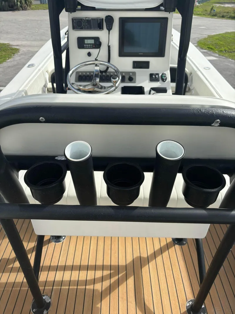 Slide: The Image of 2014 Andros Tarpon 26 boat cockpit with rod holders and navigation equipment. - 16