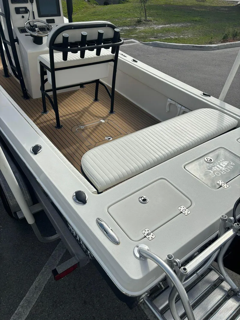 Slide: The Image of 2014 Andros Tarpon 26 boat interior with seating and control console. - 17