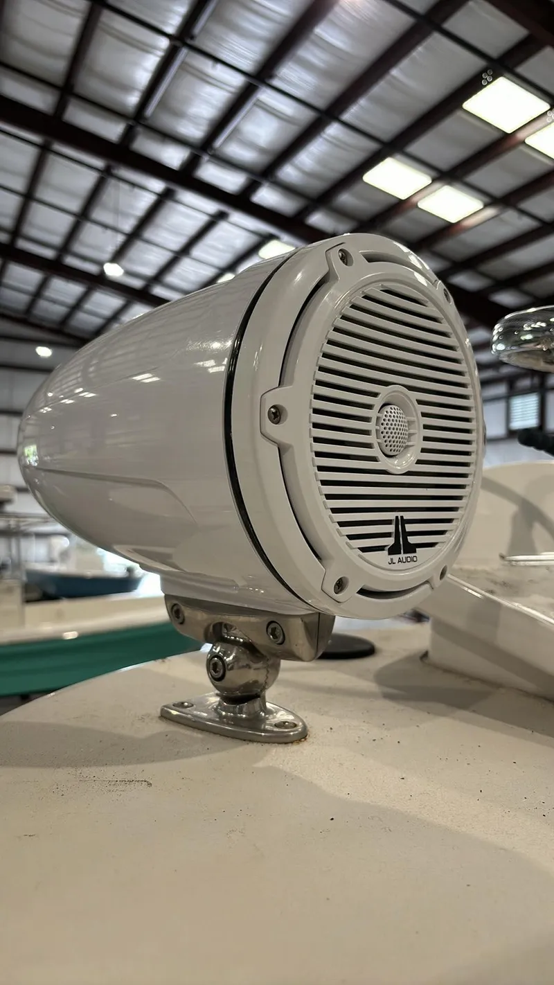 Slide: The Image of Close-up of a 2014 Andros Tarpon 26 boat speaker in a warehouse. - 20
