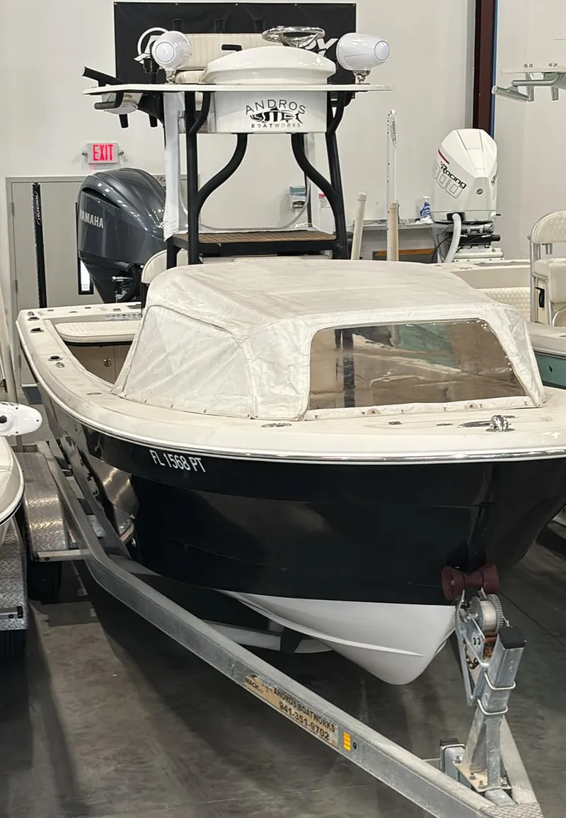 Slide: The Image of 2014 Andros Tarpon 26 boat on trailer in indoor storage. - 6