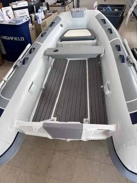 Slide: The Image of 2024 Highfield Classic 310 inflatable boat with grey deck and white interior. - 2