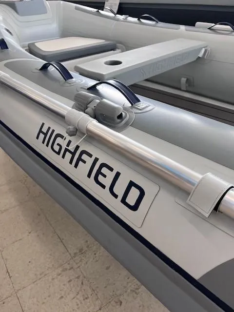 Slide: The Image of 2024 Highfield Classic 310 inflatable boat interior with seating and oar holders. - 3
