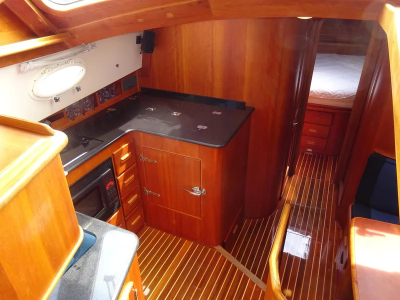 Slide: The Image of Interior of 2002 Hinckley Talaria 44 FB yacht with wooden cabinetry and flooring. - 17