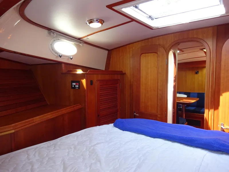 Slide: The Image of Interior of 2002 Hinckley Talaria 44 FB yacht with wooden finish and cozy cabin. - 31