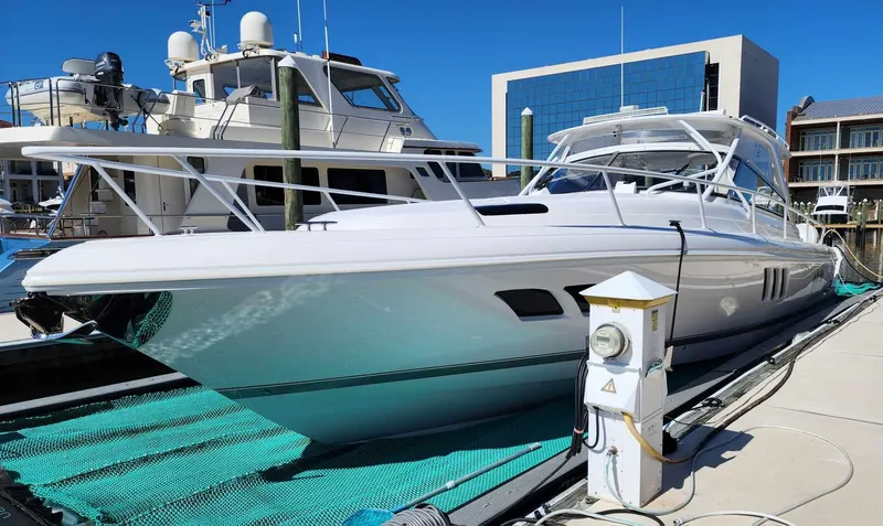 Slide: The Image of 2020 Intrepid 475 Sport Yacht docked at marina on a sunny day. - 3