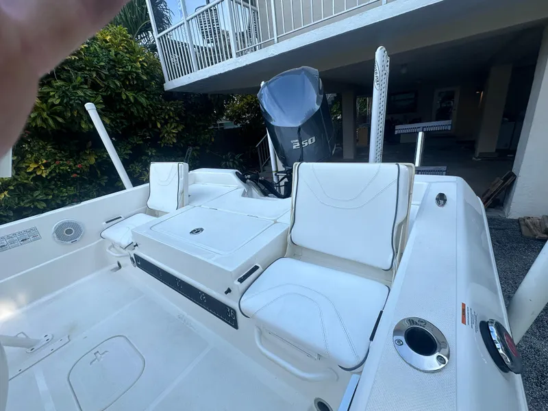 Slide: The Image of 2021 Skeeter SX 2250 boat interior with white seating and Yamaha 250 engine. - 13