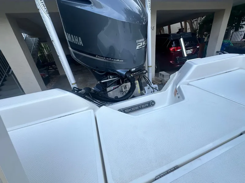 Slide: The Image of 2021 Skeeter SX 2250 boat with Yamaha outboard motor in a garage. - 17