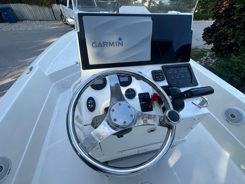 Slide: The Image of 2021 Skeeter SX 2250 boat console with Garmin navigation system and steering wheel. - 18